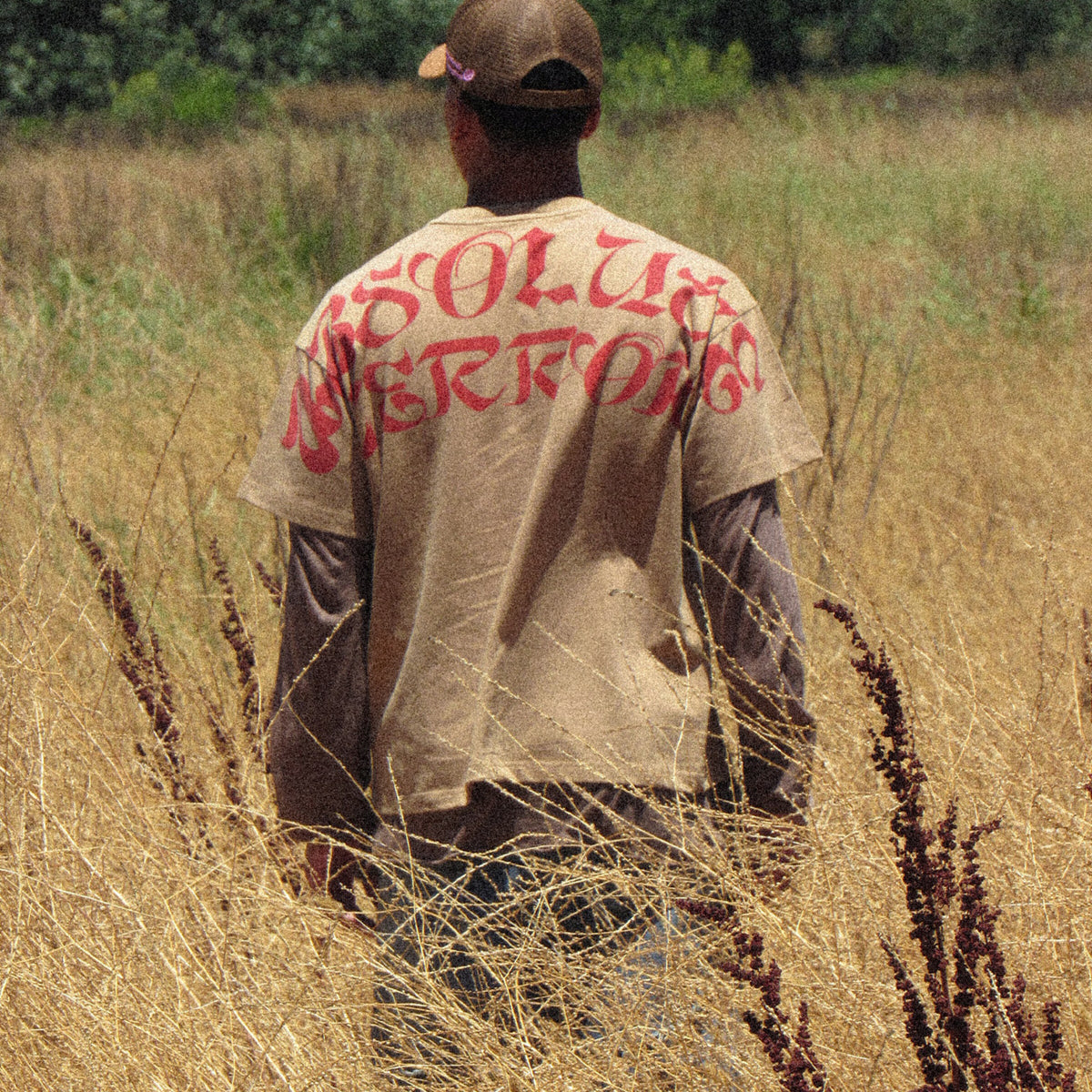 Absolute Arc Tee worn, red arc print across the shoulders